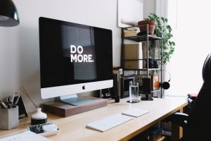 computer monitor with text "do more"
