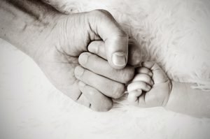 father and baby hands
