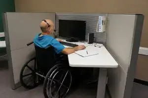 man in wheelchair working at call center