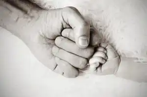 father and baby hands