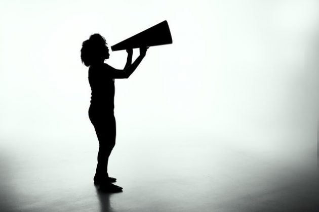 persuasion image: silhouette of girl with megaphone