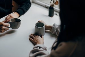 showing empathy through listening while drinking coffee