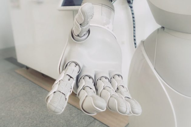 artificial intelligence robot reaching out hand